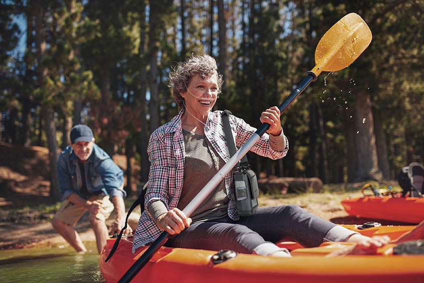 Woman kayaking with portable oxygen