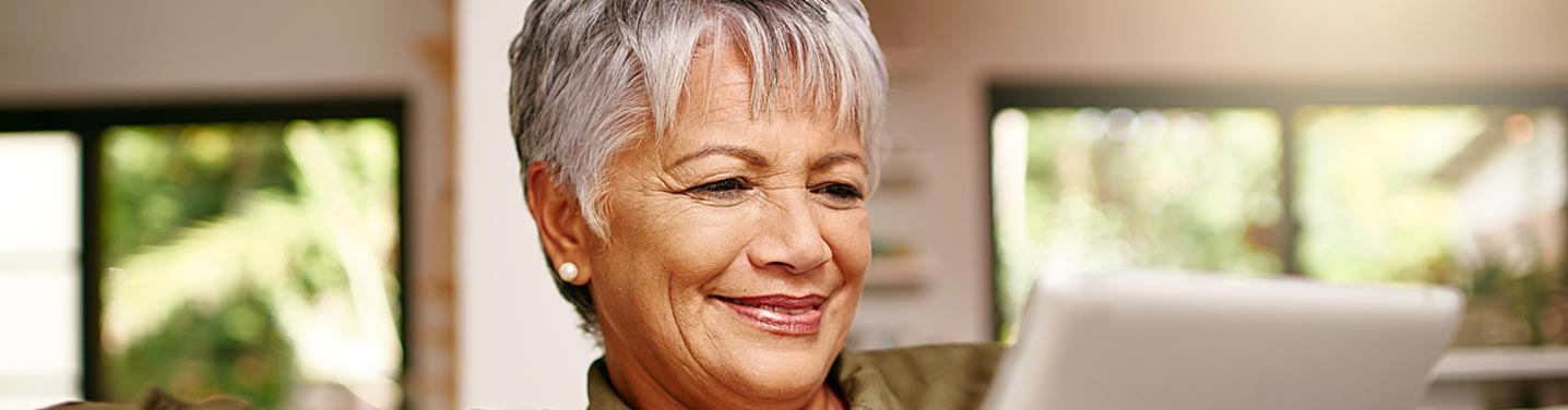 Older woman paying an Owens equipment bill