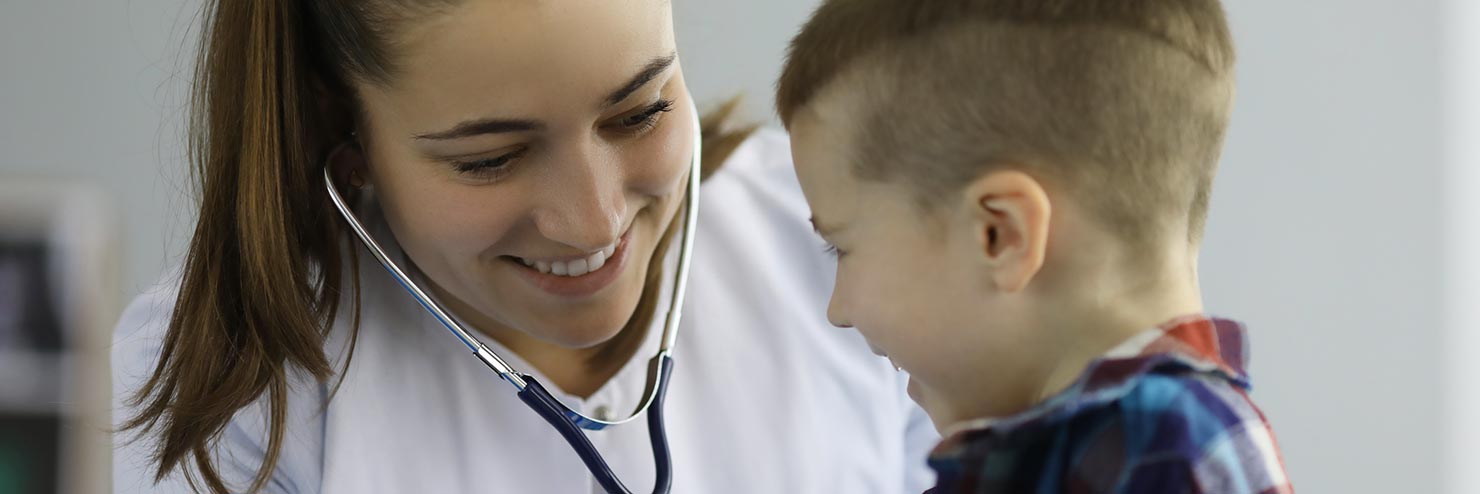 Doctor listening to a child breath